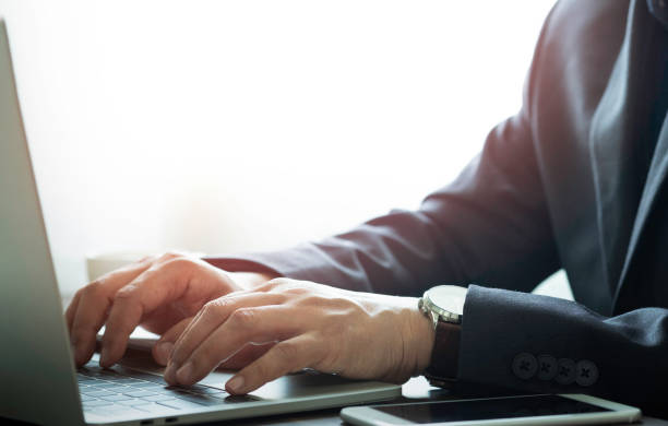 istock man hands using keyboard of laptop computer on office desk. Workspace, businessman working project creative idea for the job with copy space. Business investment-finance accounting concept. 1325205625