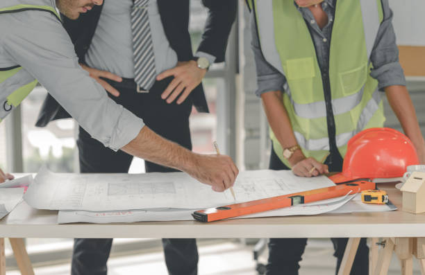 istock Engineers team meeting for architectural project. architects discussing blueprint with construction manager in office worker conference site. Construction Concept 1325205878