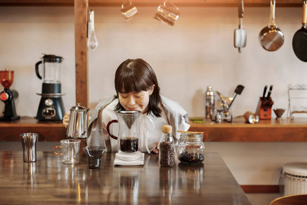istock A young woman brewing coffee with a hand drip 1325207248