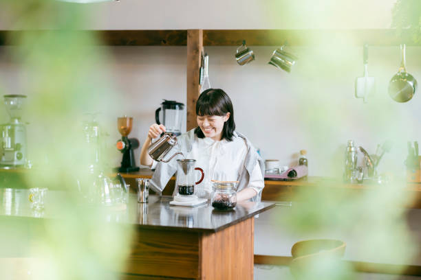istock A young woman brewing coffee 1325207691
