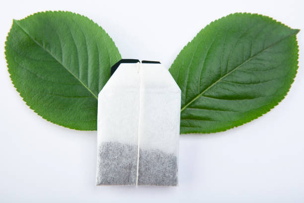 istock image of tea pocket leaf white background 1325207838
