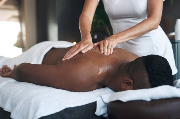 istock Shot of a young man getting a back massage at a spa 1325208702