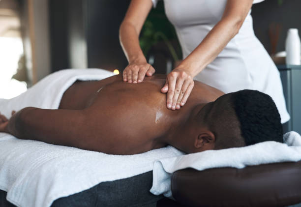 istock Shot of a young man getting a back massage at a spa 1325208705