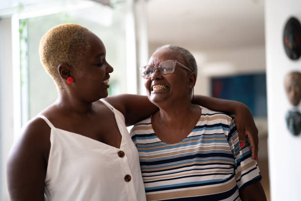istock Mother and daughter embracing at home 1325209375