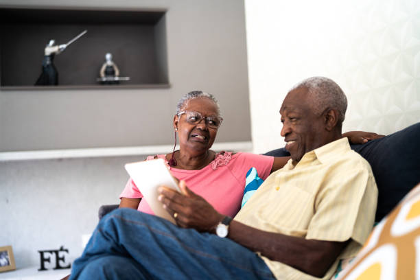 istock Senior couple using digital tablet at home 1325209378
