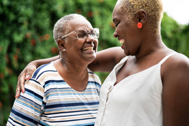 istock Mother and daughter embracing at home 1325209379