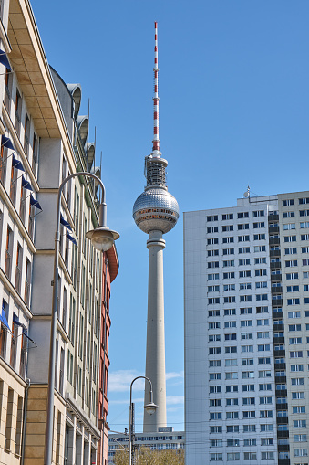 The TV Tower of Berlin and some apartment buildings, one of them a typical GDR Plattenbau