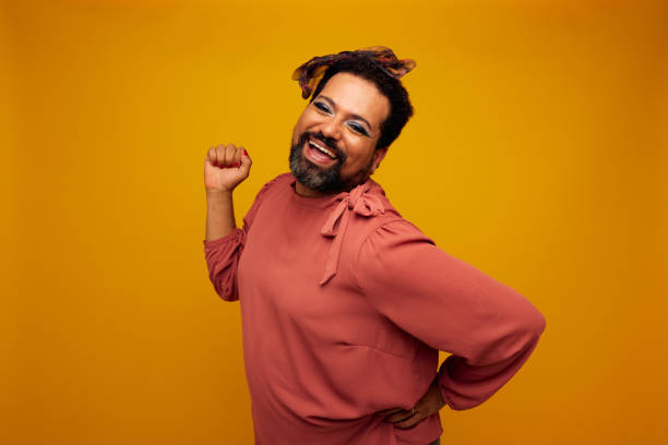 istock Gender fluid model posing in female outfit and makeup 1325211551