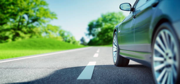 istock Car on sunny road 1325212019