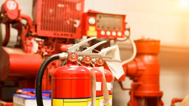 istock The red fire extinguisher is ready for use in case of an indoor fire emergency. 1325217584