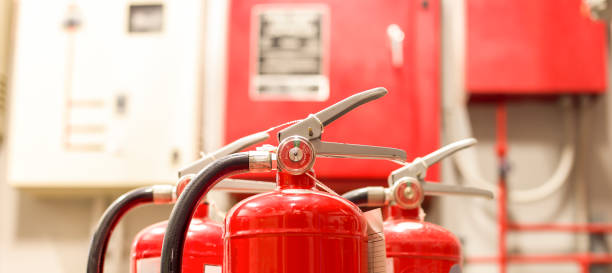 istock The red fire extinguisher is ready for use in case of an indoor fire emergency. 1325217588