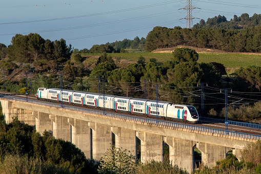 Ouigo company high-speed train on the Barcelona-Sants to Madrid Puerta de Atocha route. Photo taken in the town of Lavern Subirats (province of Barcelona) on May 05, 2021