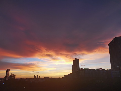 Evening sunset with dramatic sky cityscape captured by mobile phone