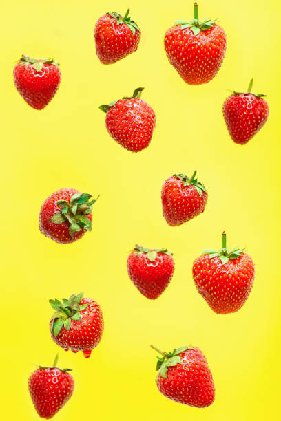 istock Strawberry berry levitating on ayellow background 1325221335