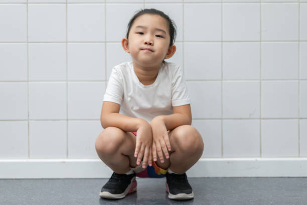 istock Tired Little Girl Crouch Resting 1325225522