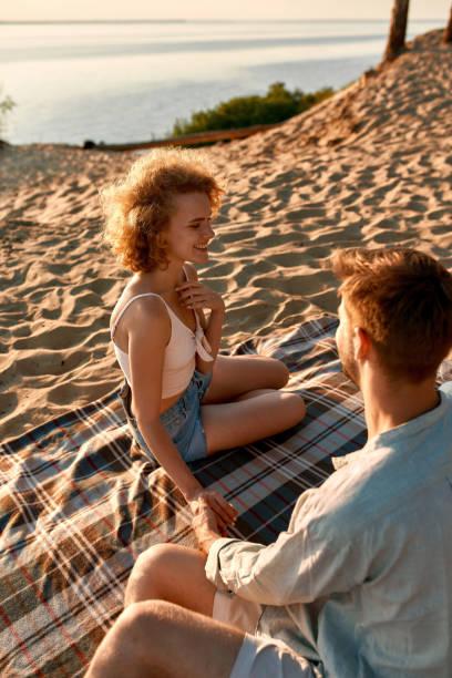 istock Laughing young caucasian couple holding hands 1325225891