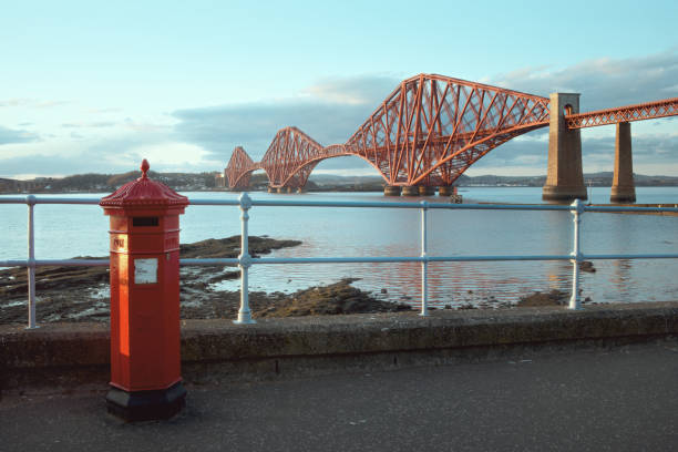 istock A red vintage British post box in front of the old red bridge 1325226843