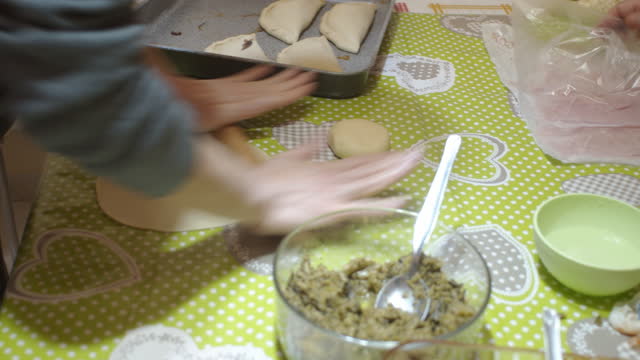 View homemade  panzerotti and calzone during the ingredient filling  process