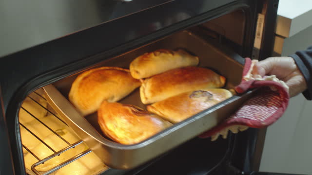 Put the calzoni also called panzerotti in the oven for cooking.