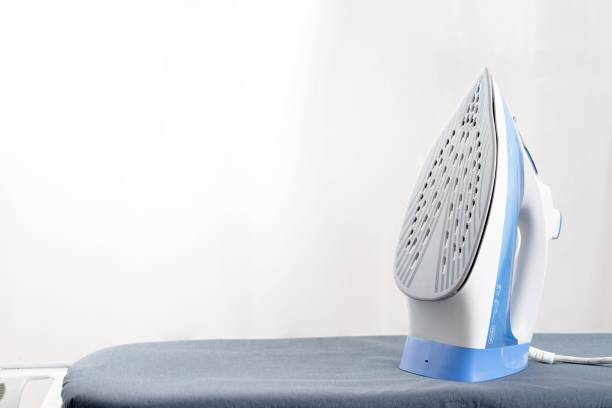 istock An electric iron and put the clothes on the ironing board. 1325228652