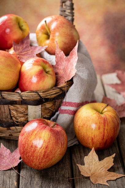 istock Tasty Red Apples on Wooden Table 1325229919