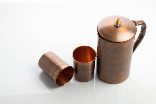istock Antique Copper Jug and Tumblers on White Background 1325233917