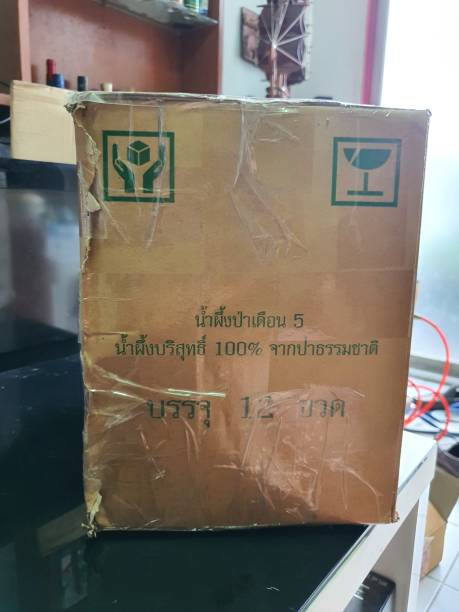 istock Bangkok,Thailand 22Jun 2021:The parcel box was torn.  and stealing goods during transportation and re-wrapped with masking tape 1325236771