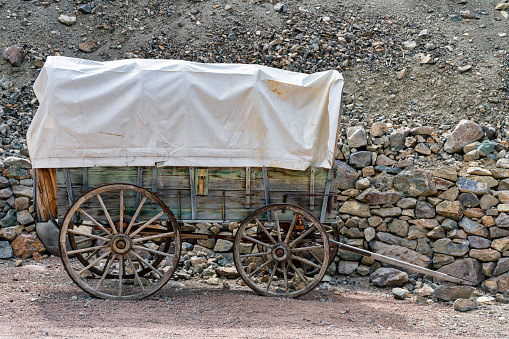 Plain WA USA Sept 14 2023: Sign for Mountain Springs Log with Antique Wagon