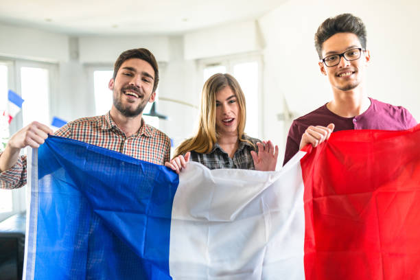 istock group of french supporter on the sofa 1325239170