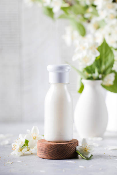 istock Cosmetic detergent with jasmine extract. Mockup of cream, shampoo, soap. 1325242889