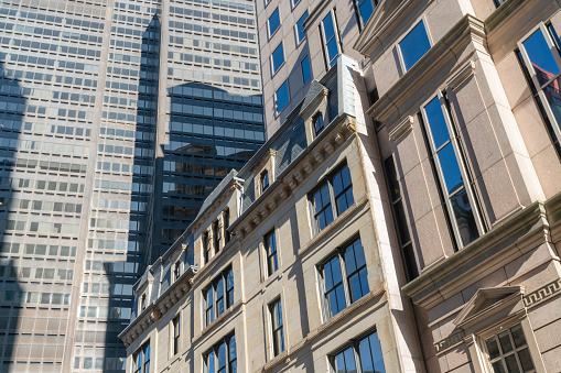 Contemporary Boston building facade design with background of modern skyscraper building