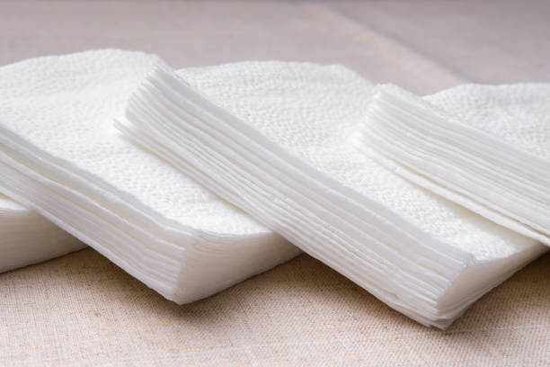 istock Small stacks of white paper napkins. 1325246953