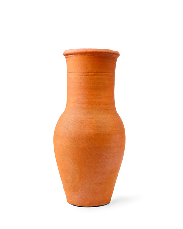 An antique and textured handmade earthenware vase in the shape of a pot is isolated on a clean white background and casts a slight soft shadow.