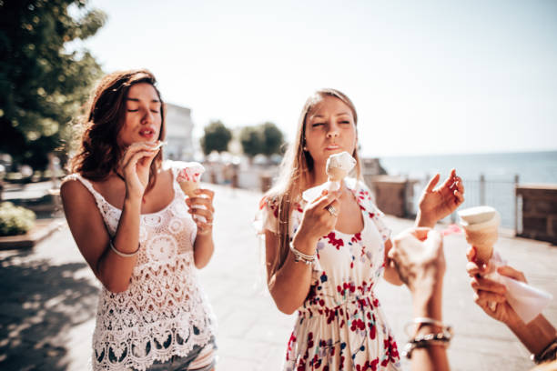 istock friends eating ice cream at summer 1325249602