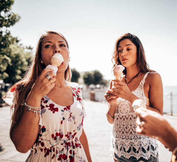 istock friends eating ice cream at summer 1325249619