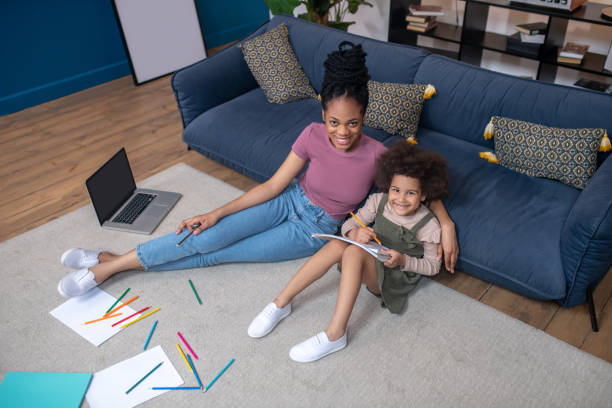 istock Top view of mom with little daughter drawing 1325250596