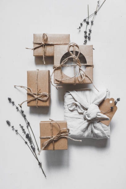 istock Gift box.Christmas zero waste box eco friendly packaging.Flat lay packs gifts kraft paper green ribbon white background,ecological Christmas holiday concept,eco decor,gift background,holiday 1325251573