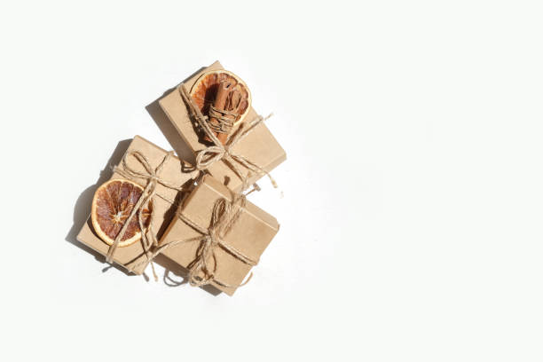 istock Gift box.Christmas zero waste box eco friendly packaging.Flat lay packs gifts kraft paper green ribbon white background,ecological Christmas holiday concept,eco decor,gift background,holiday 1325251593