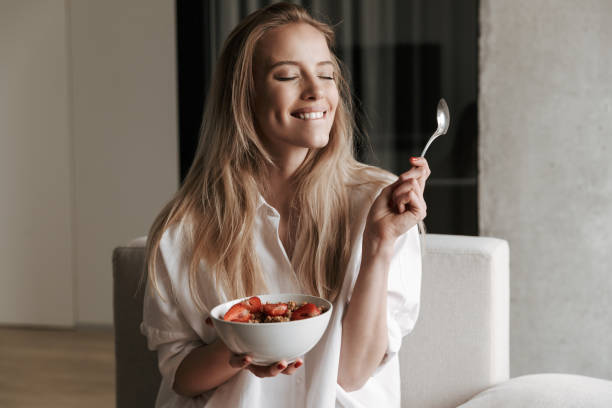 istock Satisfied young woman dressed in white shirt 1325251997