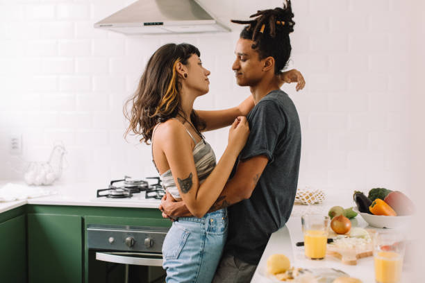 istock Interracial couple being romantic in the kitchen 1325254159