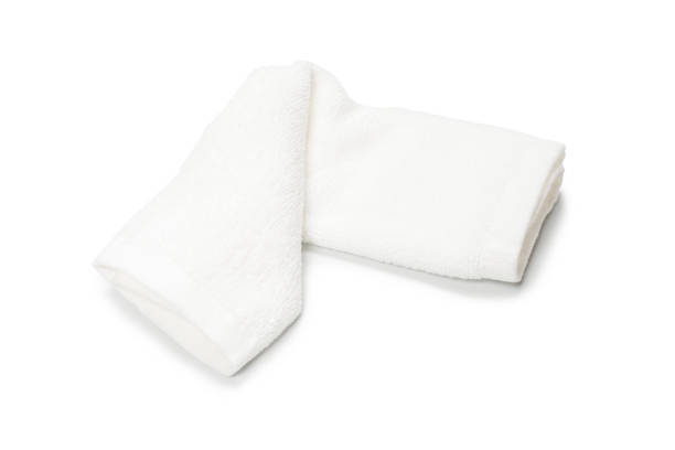 istock White fluffy cotton towel isolated on a white background. 1325255045