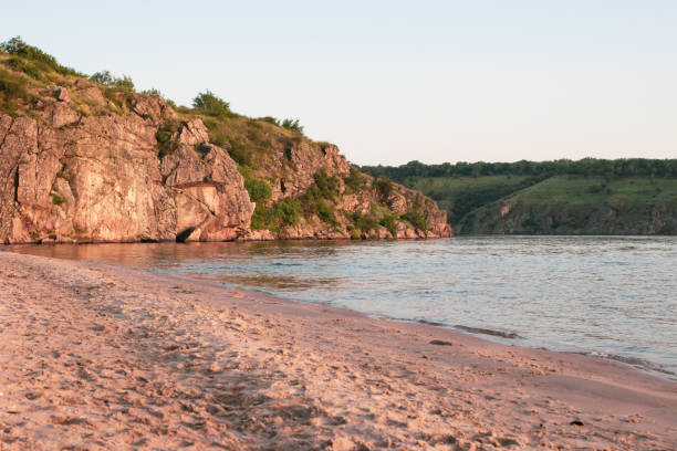 istock Beautiful landscape - river, rock, beach and sky in summer. 1325255443
