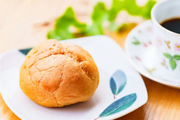 Photo of cream puff and coffee cup