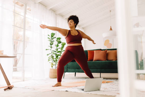 istock Fitness woman doing workout at home 1325256753