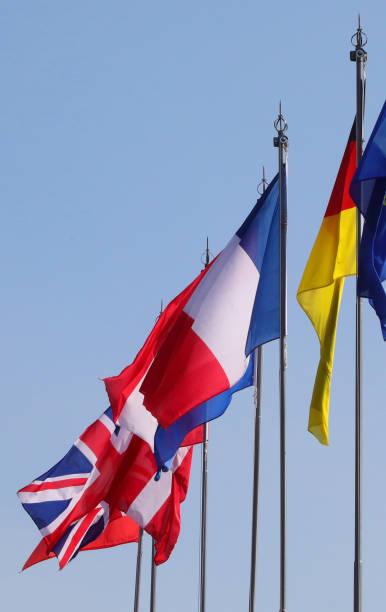 istock many international flags during the meeting 1325256955