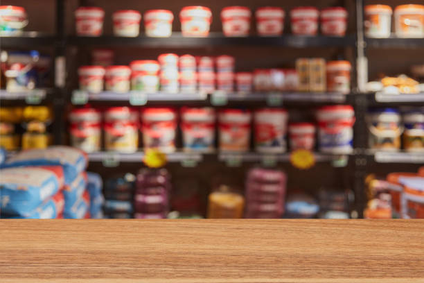 Empty log color desktop in front of blurred building materials store shelves background