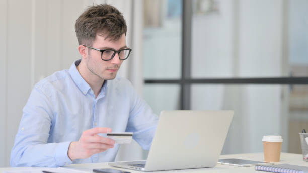 istock Successful Online Payment on Laptop by Young Man 1325257915