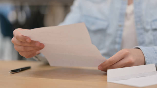 istock Male Hands Reading Letter, Close up 1325258415