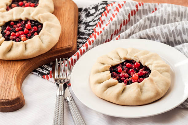 Healthy breakfast. Homemade lenten galette with elderberries and cowberries