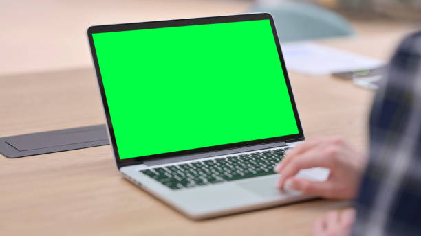 istock Female Hands using Laptop with Green Chroma Key Screen 1325261213